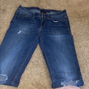 Blue jeans with holes In knees
